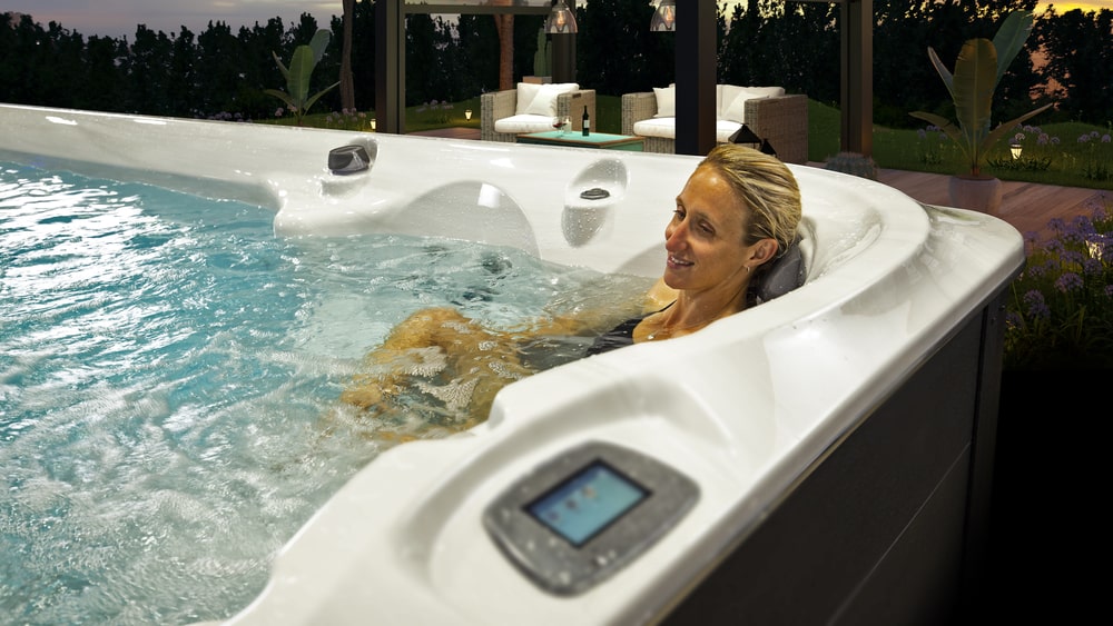 Woman Enjoying Soothing Hydrotherapy in Swim Spa